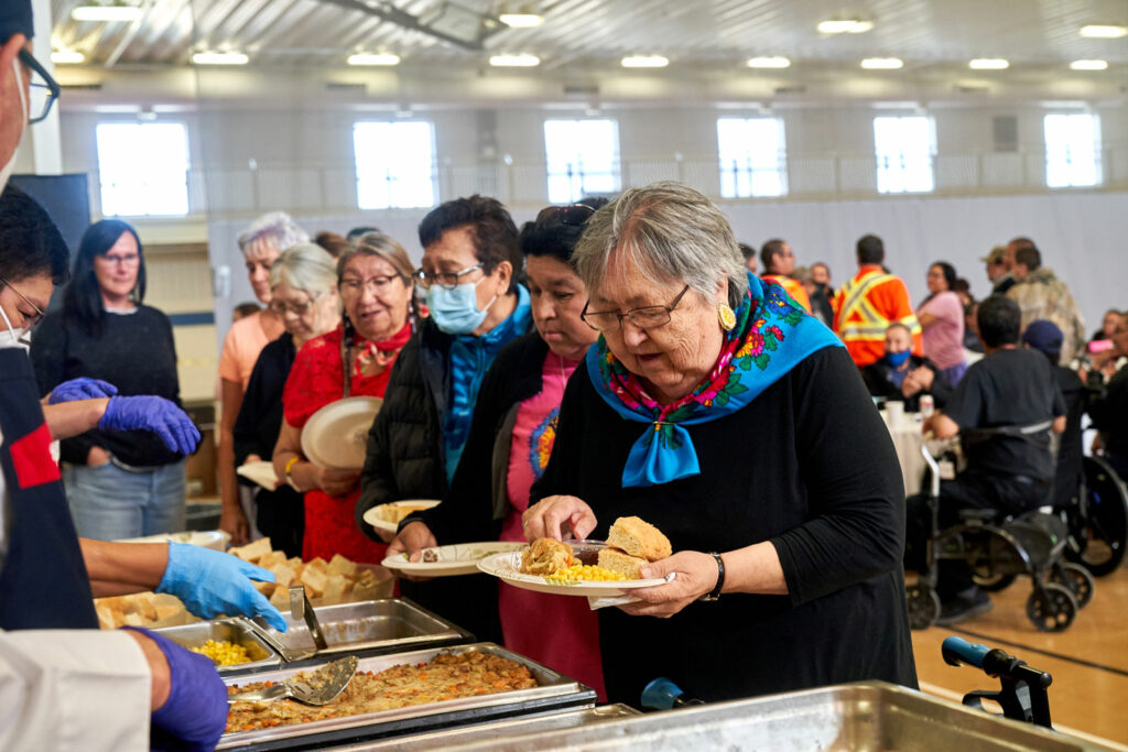 Indigenous elders are served a meal from the selection at the buffet.